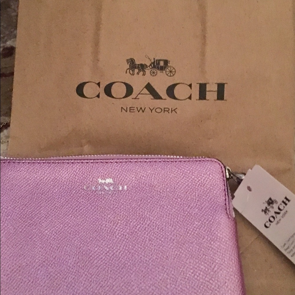 A Lovely Coach Lilac Wristlet.
